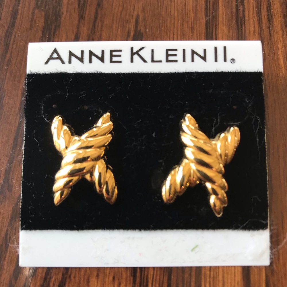 Anne Klein II gold “X” motif pierced earrings.